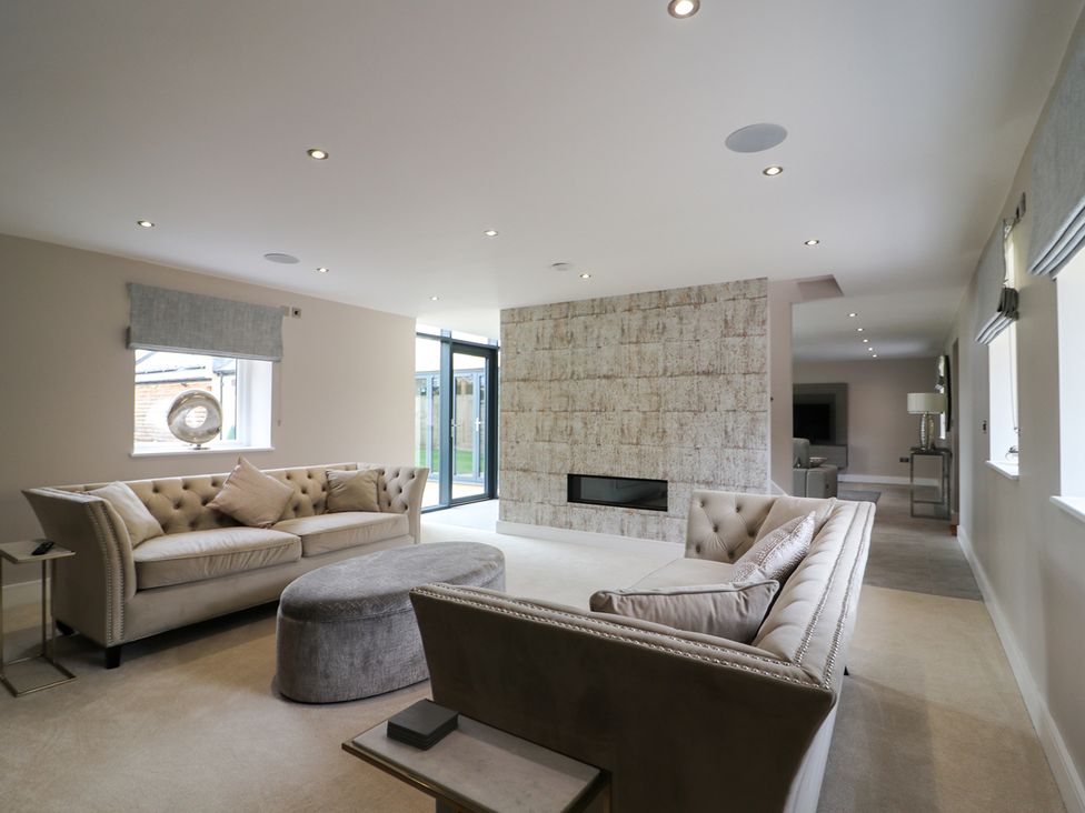 A living room with sofas and a fireplace at Northumberland Luxury Stays - The Chivits near West Chevington