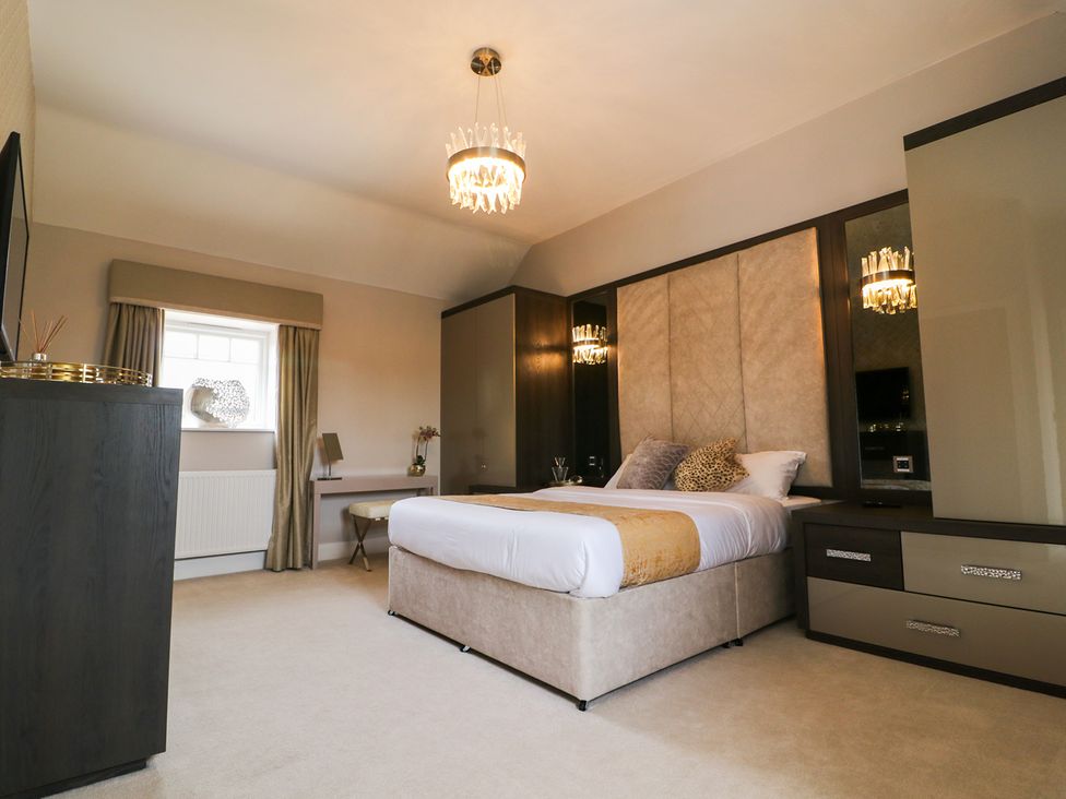 A bedroom with a bed and furniture at Northumberland Luxury Stays - The Chivits near West Chevington