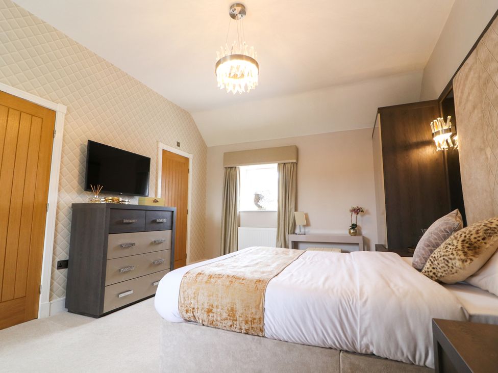 A bedroom with a bed and television at Northumberland Luxury Stays - The Chivits West Chevington near Amble