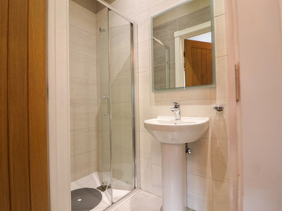 A bathroom with a sink and shower at Northumberland Luxury Stays - The Chivits near Amble