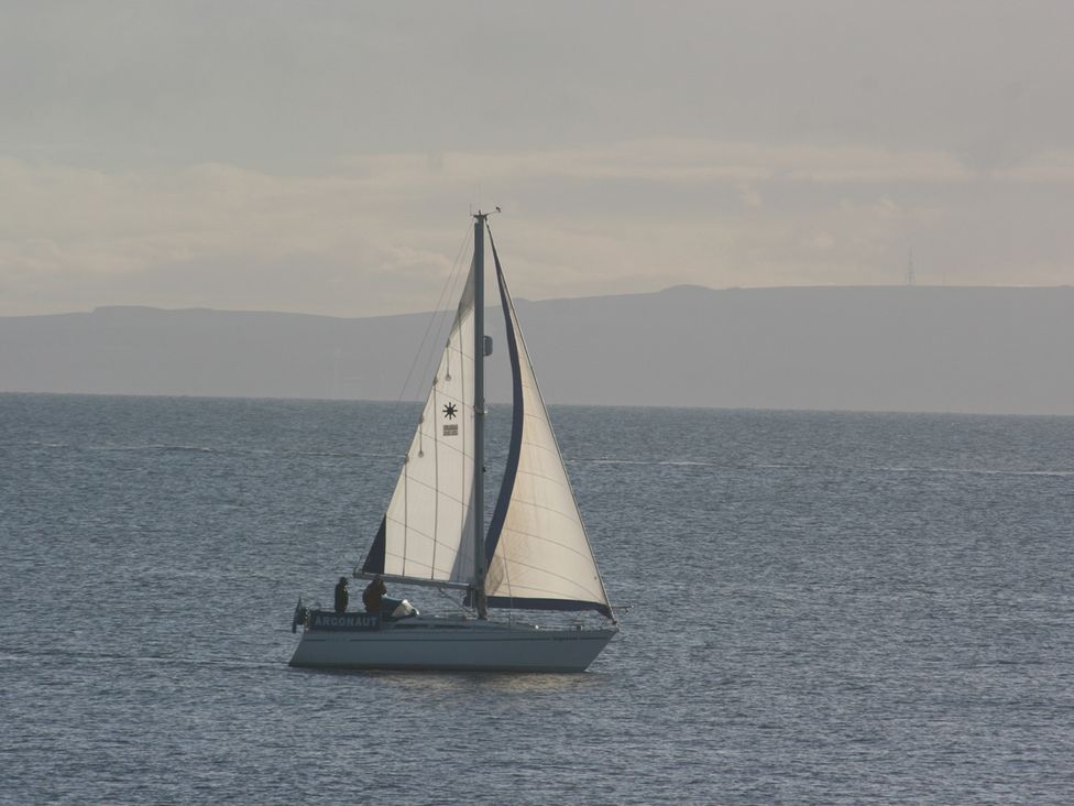 A sailboat in the ocean at Cellardyke 3-Bed House, Sleeps 6 with Sea Terrace, Cellardyke