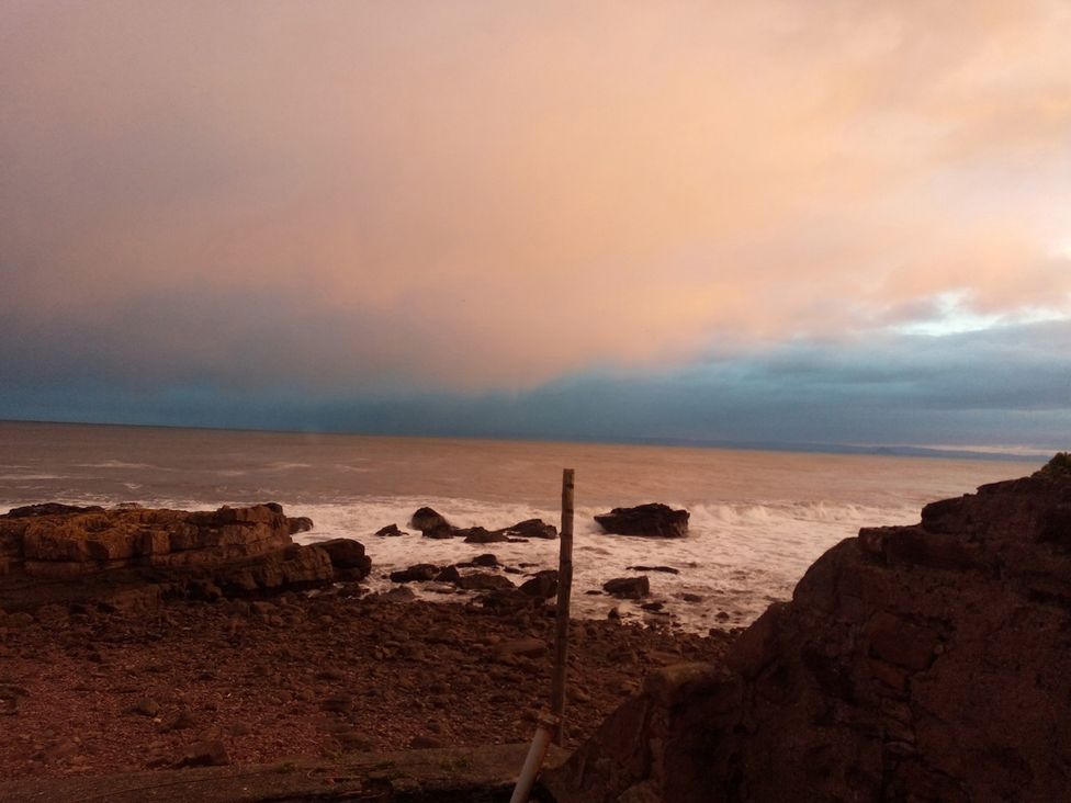 A view of the ocean with rocks and waves at Cellardyke 3-Bed House, Sleeps 6 with Sea Terrace in Cellardyke
