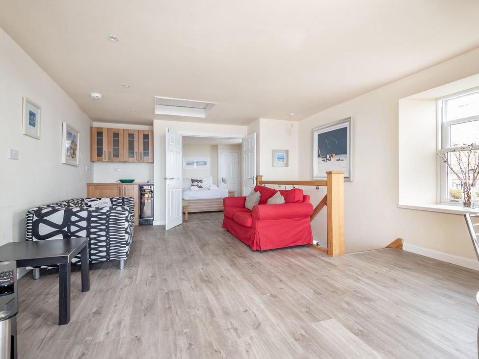 A living room with a sofa and coffee table at Cellardyke 3-Bed House, Sleeps 6 with Sea Terrace in Cellardyke