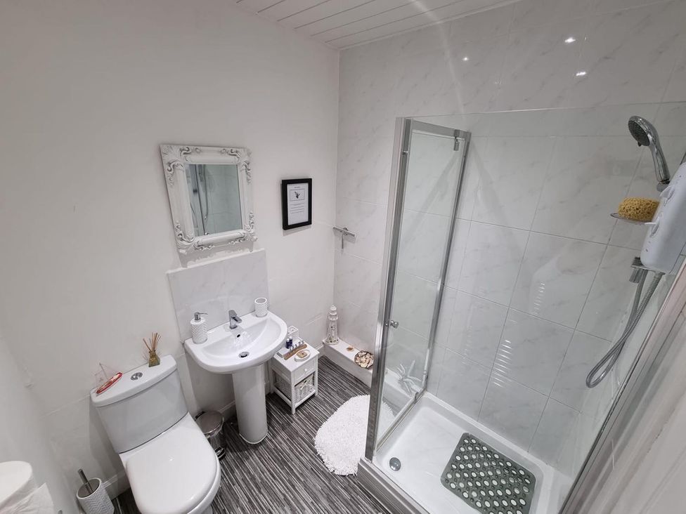 A bathroom with a shower and sink at Rose Apartment 2-Bed Apt, Sleeps 4 Town Centre Ayr