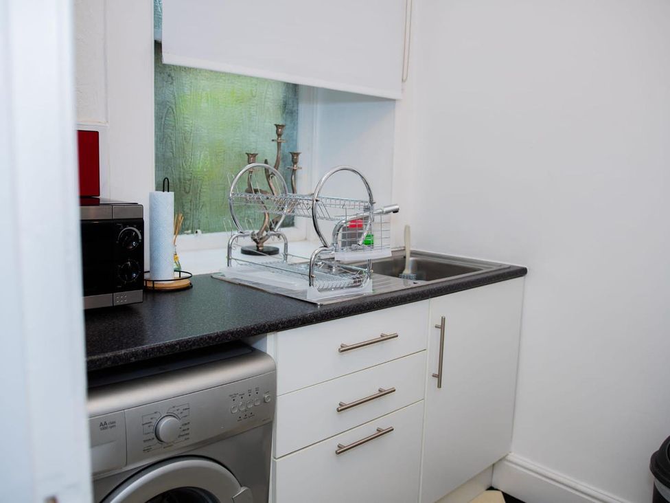 A kitchen with a dish rack and microwave at Rose Apartment 2-Bed Apt, Sleeps 4 Town Centre Ayr