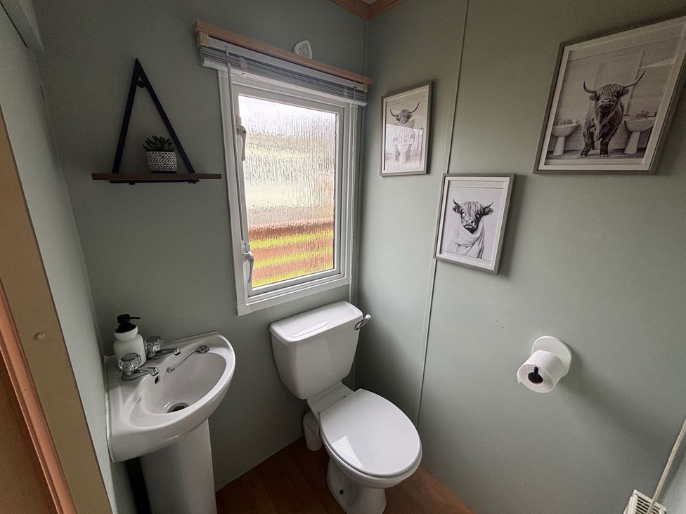 A bathroom with a sink and toilet at No 38 Heilan Hoose at Three Lochs Newton Stewart