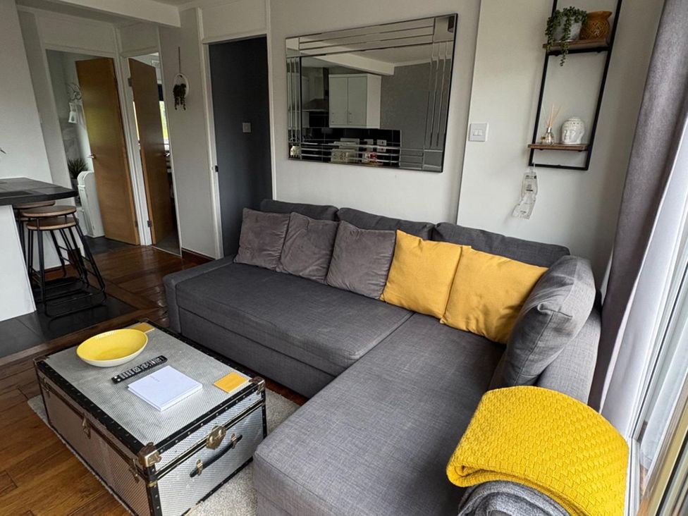 A living room with a sofa and coffee table at Pet Friendly 2-Bed Lodge, Sleeps 5, Pool & Parking, Caernarfon