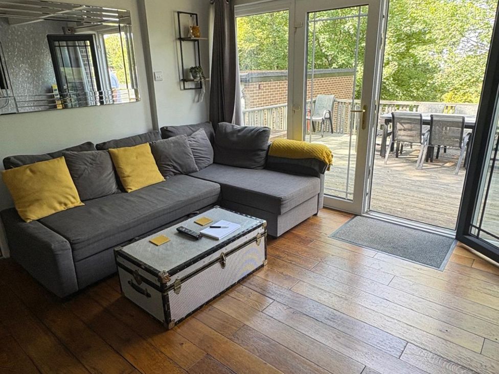 A living room with a sofa and coffee table at Pet Friendly 2-Bed Lodge, Sleeps 5, Pool & Parking, Caernarfon