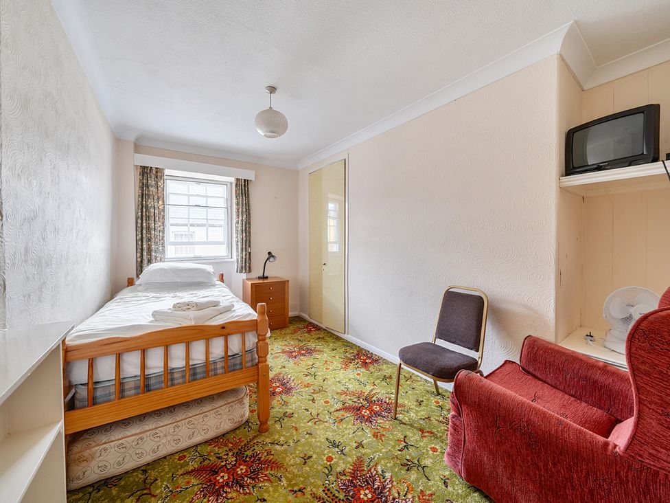 A bedroom with a bed and furniture at House in historic village - Sleeps 6 Dunster