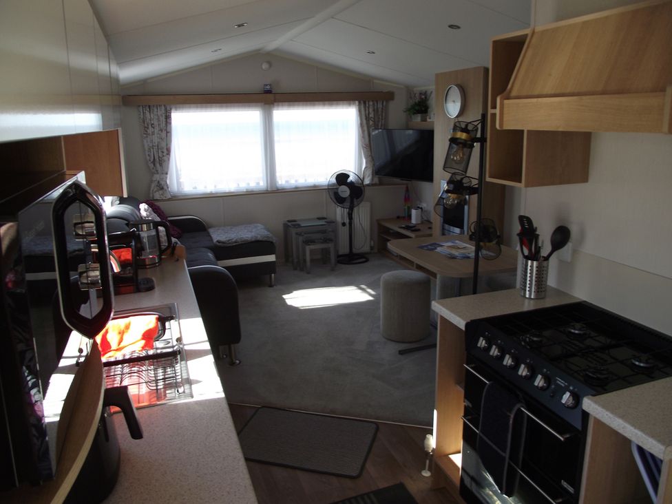 A living room with a sofa and coffee table at Seafront Caravan - Golden Sands - 6 Berth by Your Away Stays in Kinmel Bay