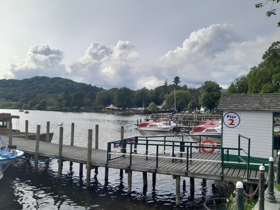 A dock with boats and pier at Pier 2 near a lake