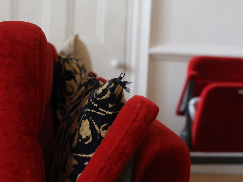 A sofa with cushions in a living room at 4BedHouse/Leominster/Hiking/Castles/Sleeps7/Wifi in Leominster