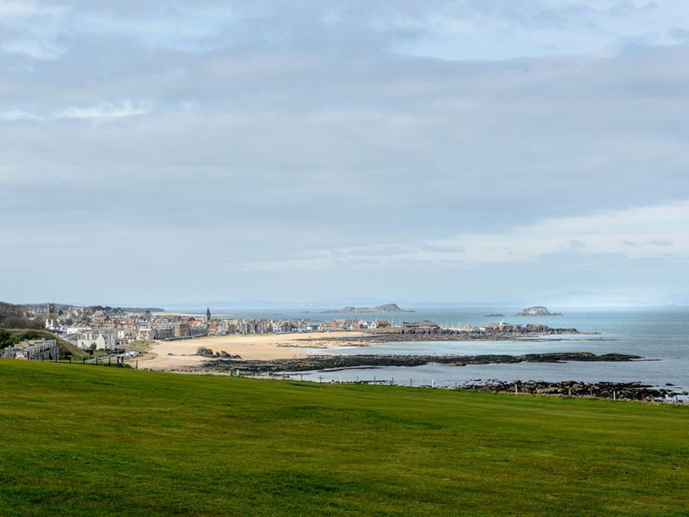 A beach with sea views and grassy area at Charming Cottage in North Berwick