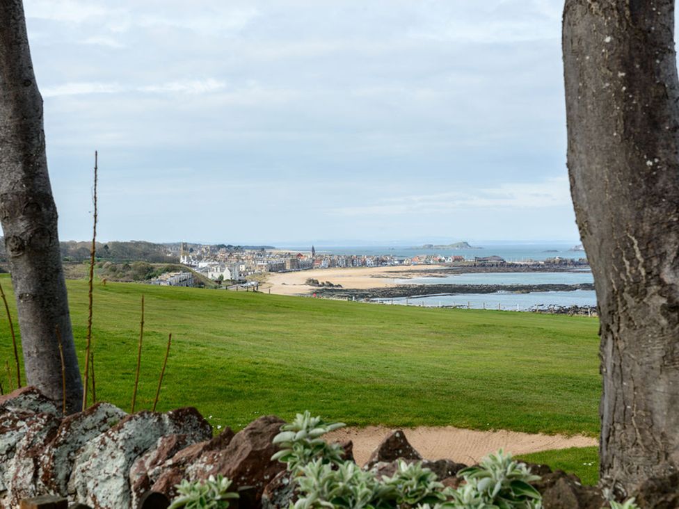 A view of a beach and town with sea at Charming Cottage in North Berwick