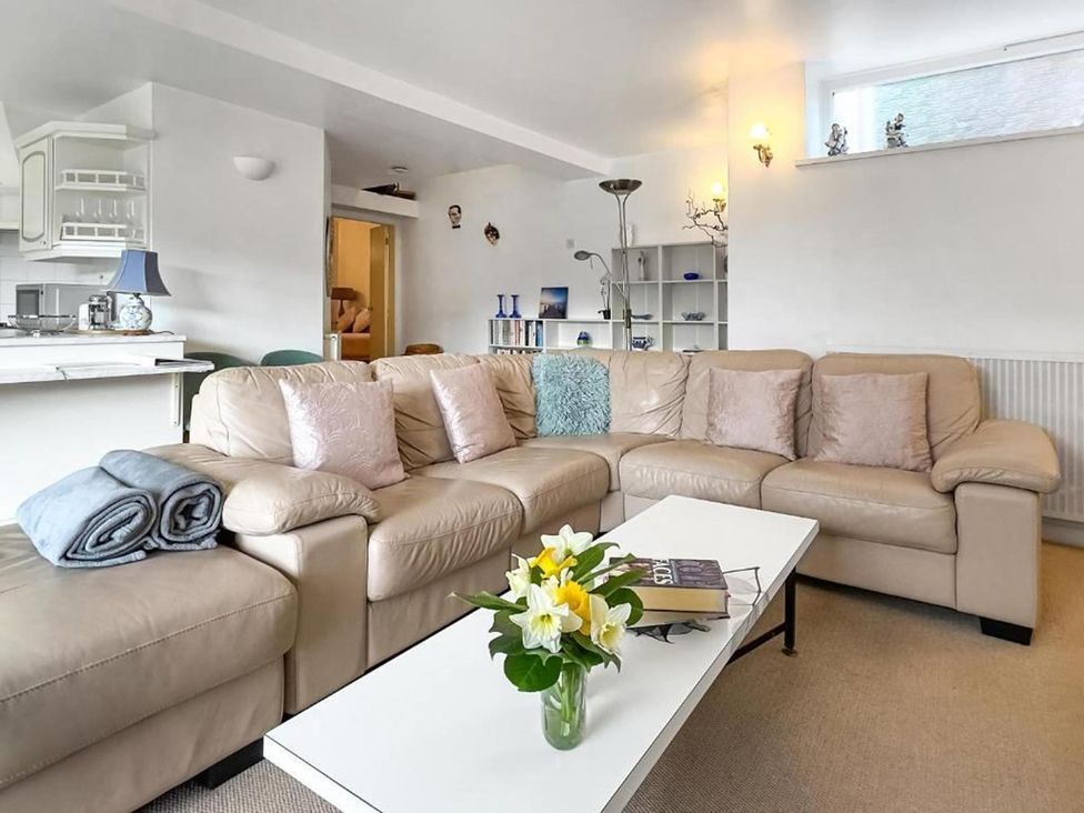 A living room with a sofa and coffee table at Apartment Sleeps 2 with Parking, Pets Welcome in Watermillock near Pooley Bridge