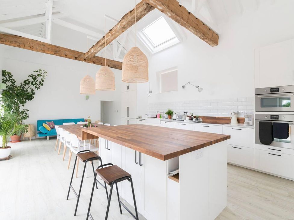A kitchen with an island and seating area at Simple Coastal Luxury near Southwold sleeps 10 Near Southwold
