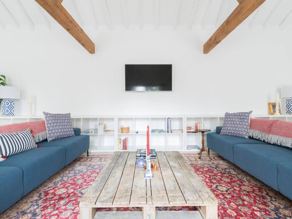 A living room with sofas and a coffee table at Simple Coastal Luxury near Southwold