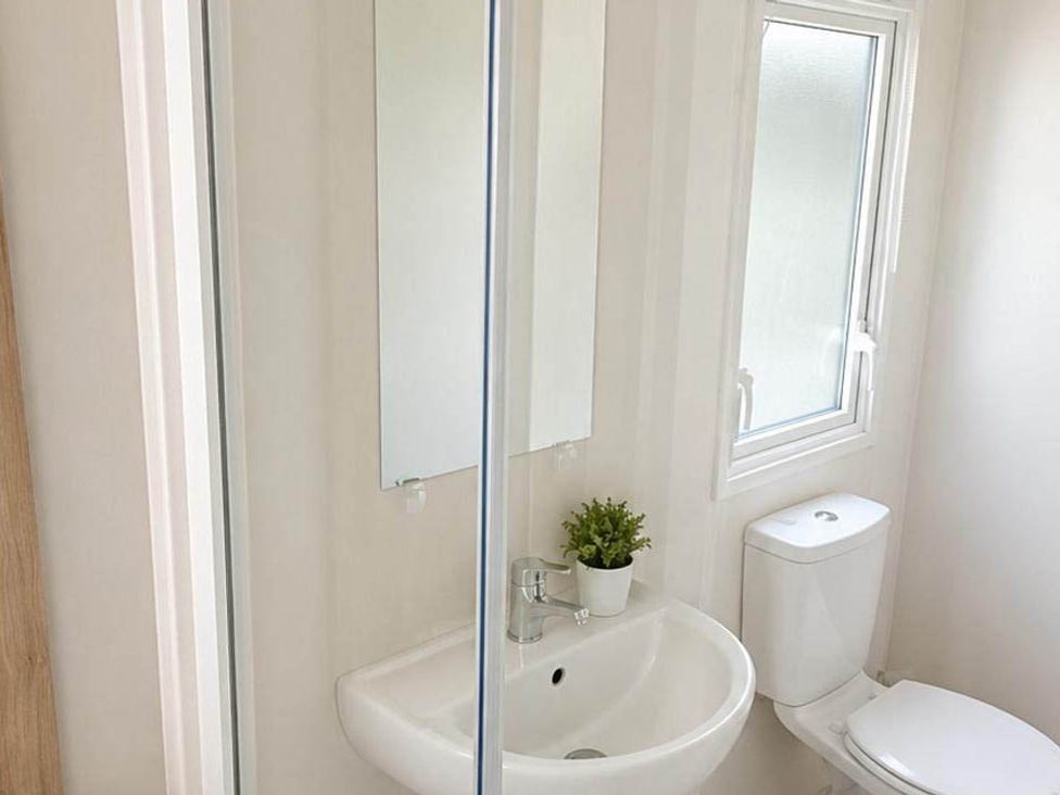 A bathroom with a sink and toilet at Billing Aquadrome Holiday Park - 2 Bedroom, Silver, Northampton