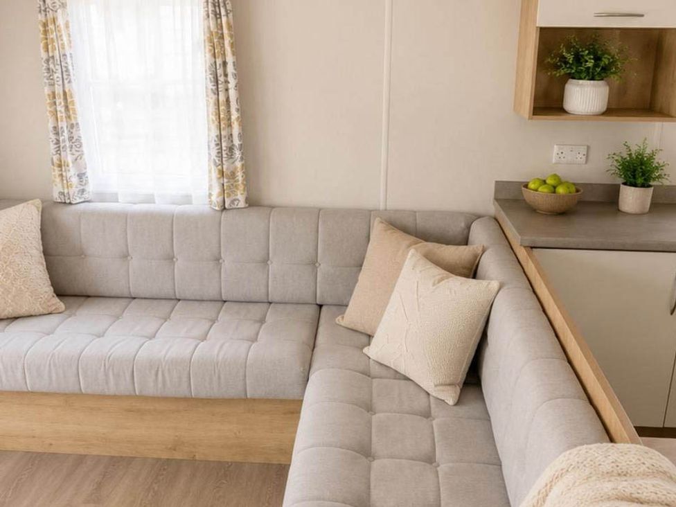 A living room with a couch and a bowl of fruit at Billing Aquadrome Holiday Park - 2 Bedroom, Silver in Northampton