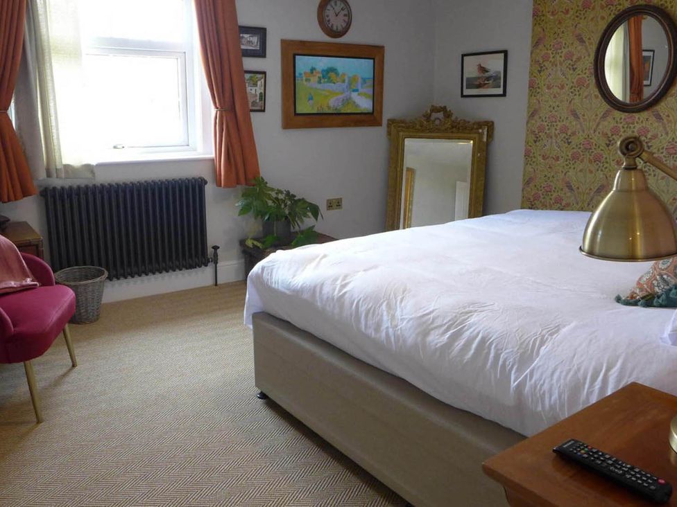 A bedroom with a bed, chair, table, and mirror at Royal Oak Retreat Sleeps 6 Pub Pet Friendly in Barcombe Cross
