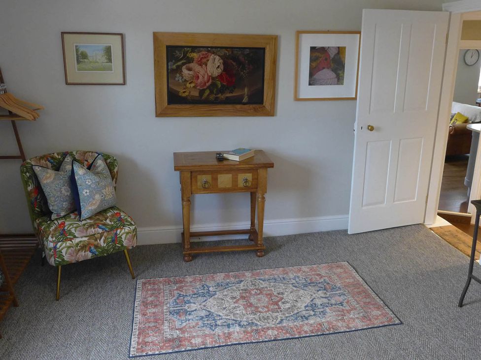 A living room with a chair and table at Royal Oak Retreat Sleeps 6 Pub Pet Friendly Barcombe Cross