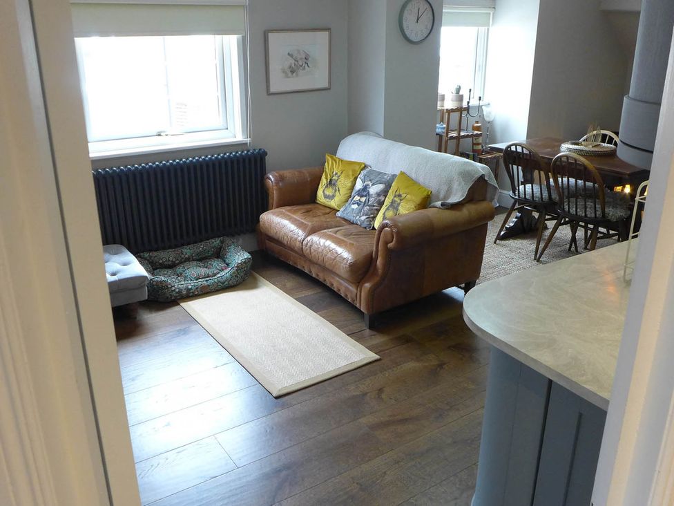 A living room with a sofa and dining area at Royal Oak Retreat Sleeps 6 Pub Pet Friendly Barcombe Cross