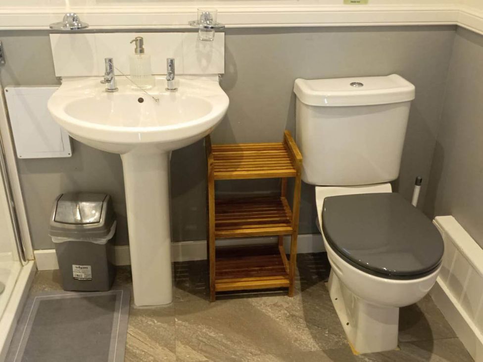 A bathroom with a sink and toilet at Marsco Apartment Garden Patio Sea Views in Applecross near Lochcarron