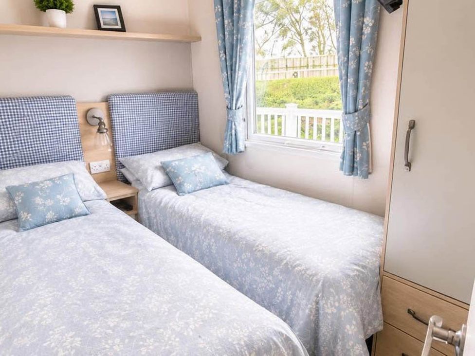 A bedroom with two beds and a window at Tattershall Lakes - Hot Tub - Sleeps 6 - Pets in Tattershall