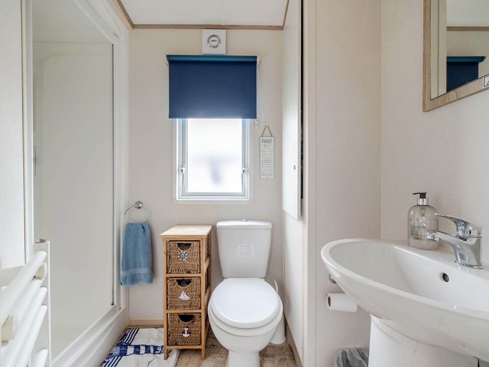 A bathroom with a toilet and sink at Cabin - Sleeps 4 - Pets Ok - Balcony - Parking, Haven Park, Doniford Bay near Watchet