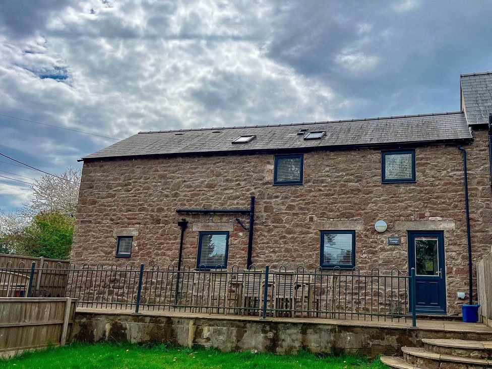 A house with stone walls and windows at Cottage Sleeps 6 Garden Parking Beaulieu Farm near Coleford