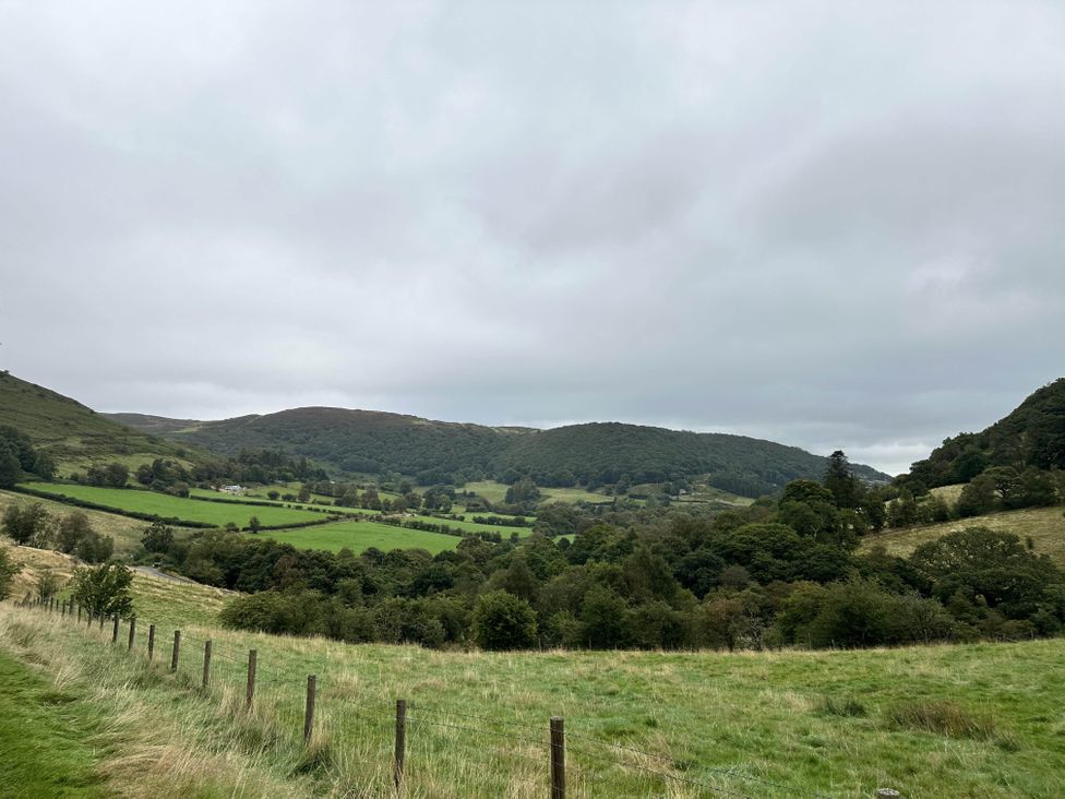 A landscape view with hills and fields in Llanidloes - Sleeps 7 - Parking - Pet Friendly, Llanidloes