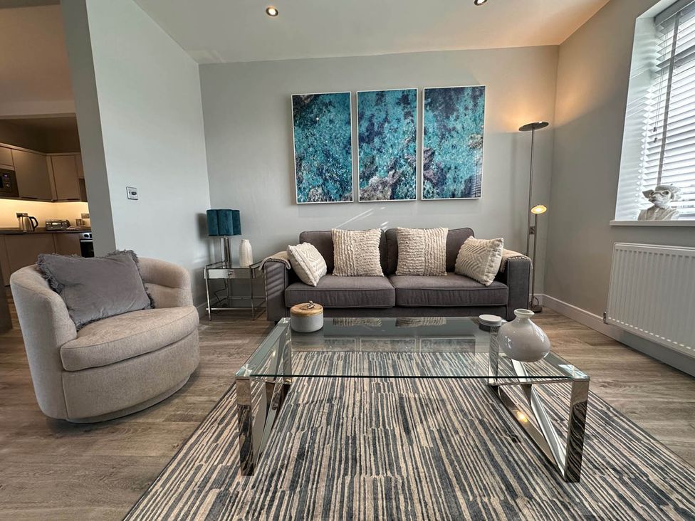 A living room with a sofa and coffee table at Stylish Home Sleeps 4 Free Parking in Earl Shilton