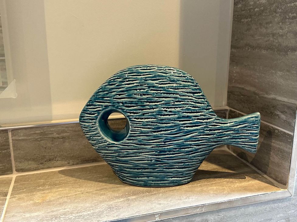 A fish-shaped vase in a living room at Stylish Home Sleeps 4 Free Parking, Earl Shilton