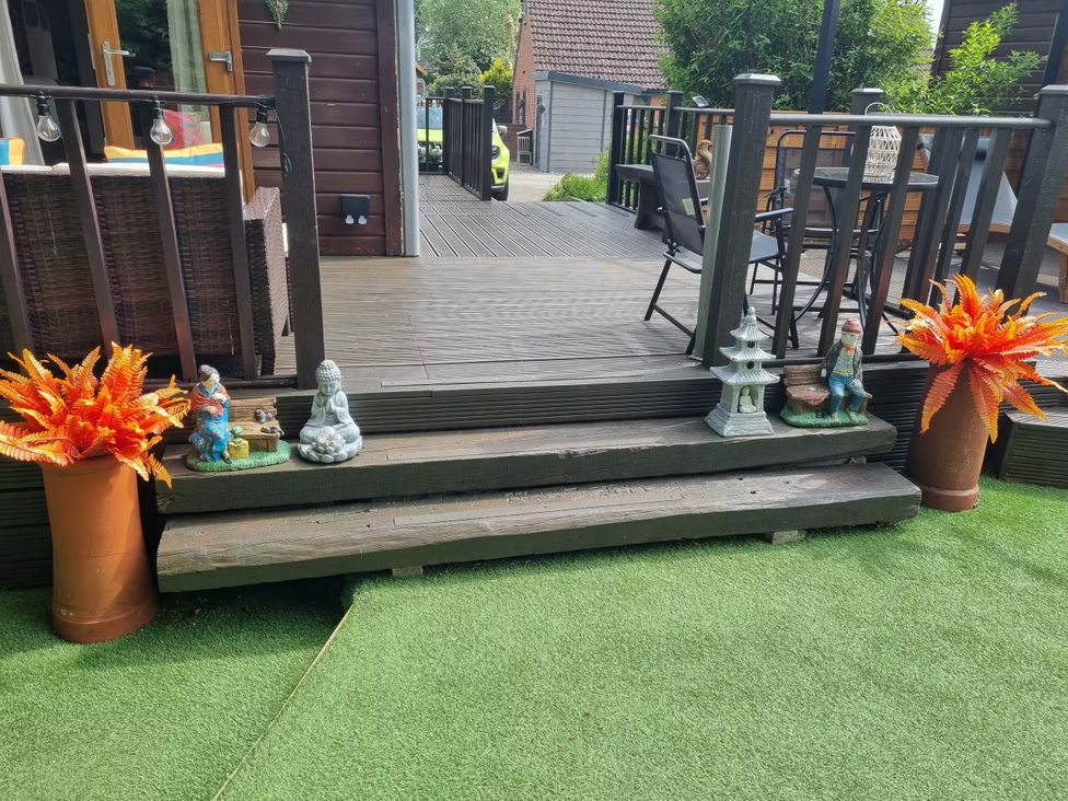 A patio area with steps and decorative items at Cabin Sleeps 4 with Hot Tub and Parking near Wilberfoss