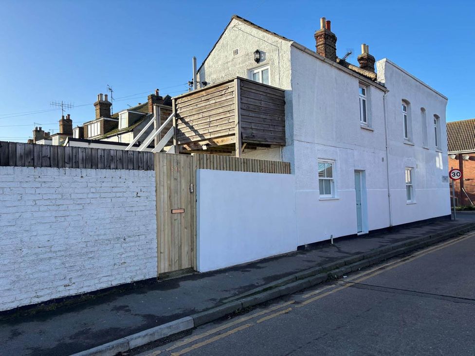 A building with a balcony and fence at 59 Whitstable in Whitstable