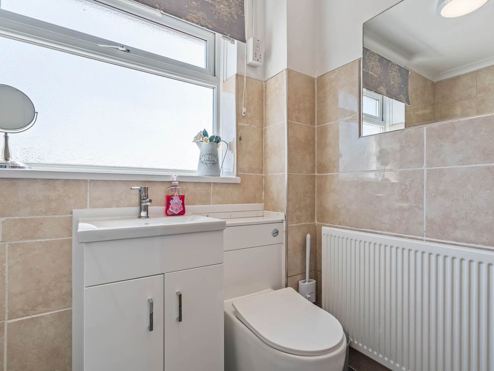 A bathroom with a sink and toilet at The Old Barn in Stafford