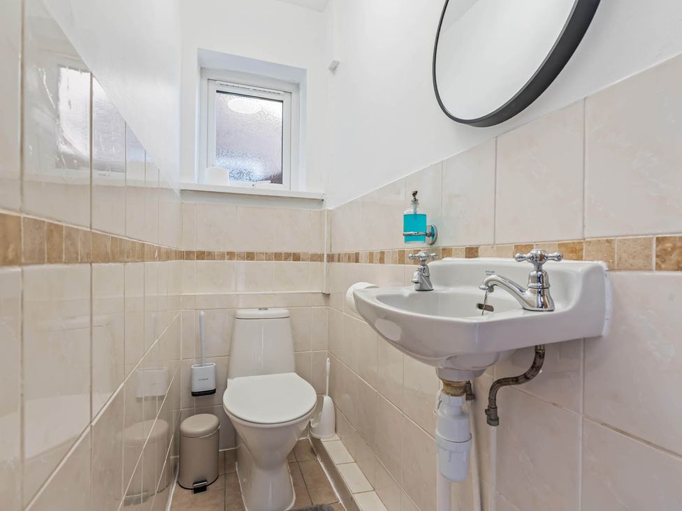 A bathroom with a sink and toilet at  in Stafford