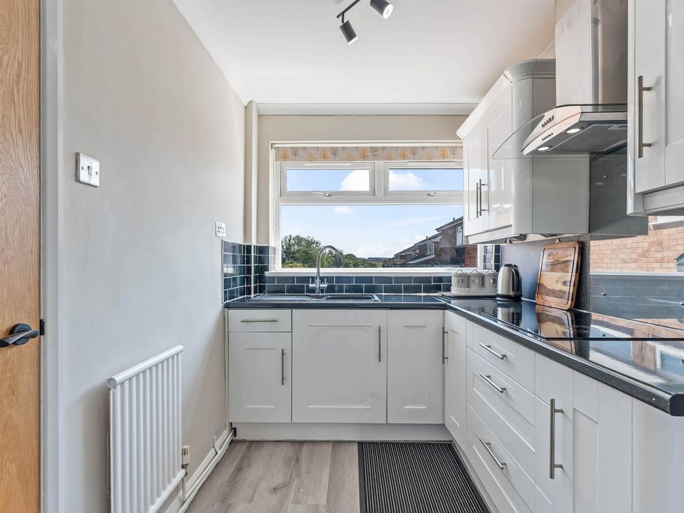 A kitchen with a sink and window at The Old Barn in Stafford