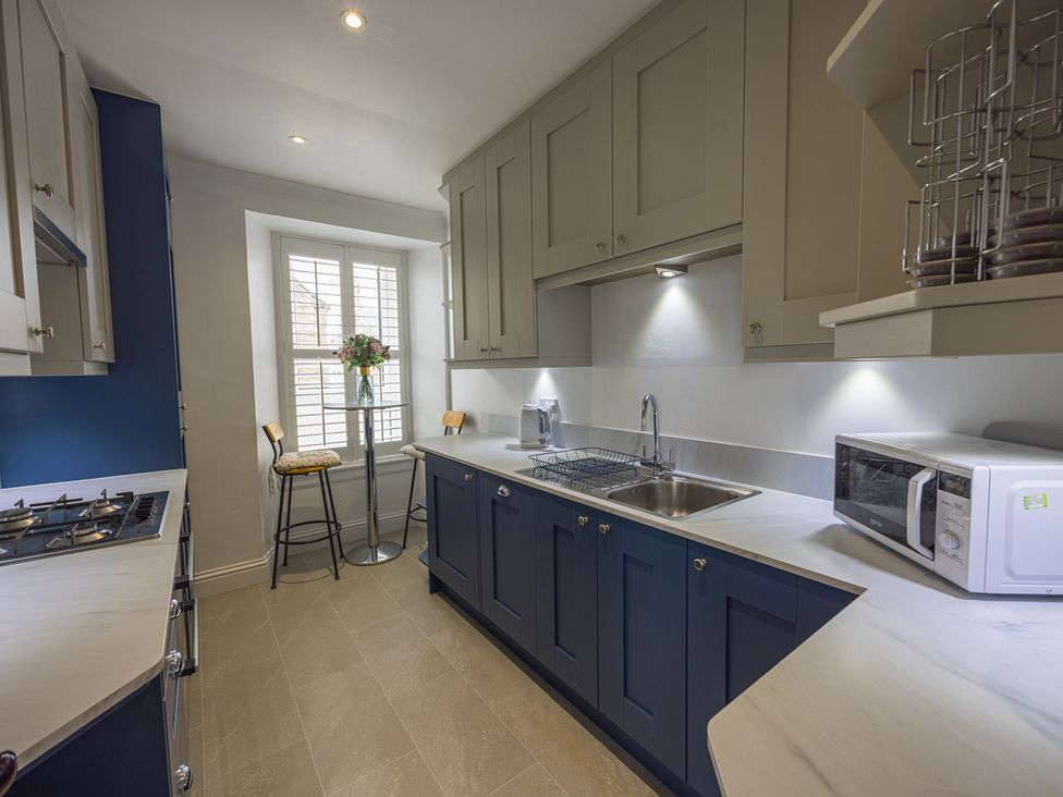 A kitchen with a sink and stove at Short Walk to the Beach - 2 Guests - Free Parking in Thurso