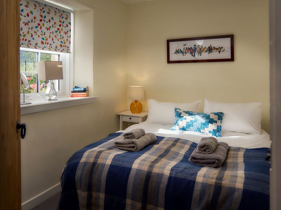 A bedroom with a bed and lamp at 