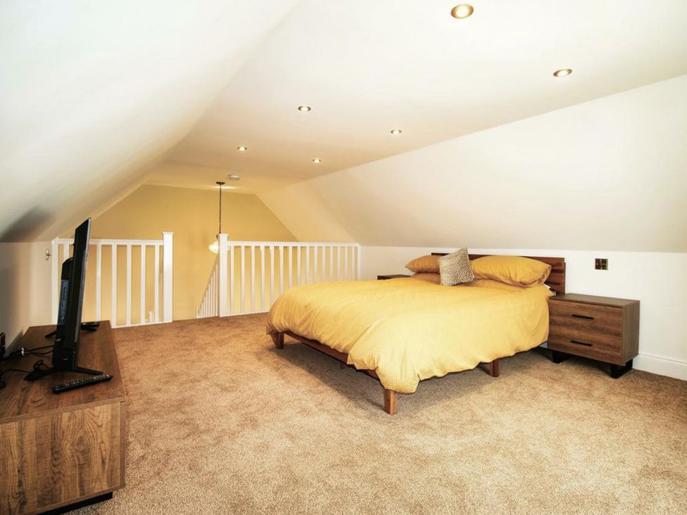 A bedroom with a bed and television at Newly Refurbished Cottage, sleeping 4 and Central Berwick-Upon-Tweed