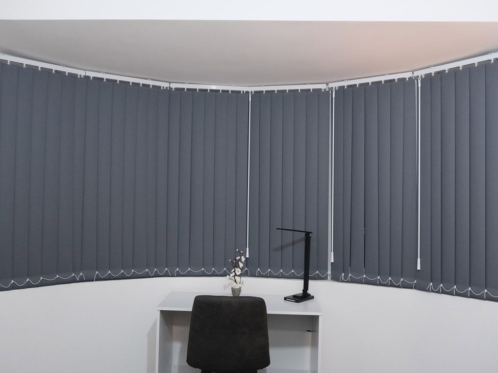 An office with a desk and chair near curtains at 3 Bedroom, Modern House in Manchester