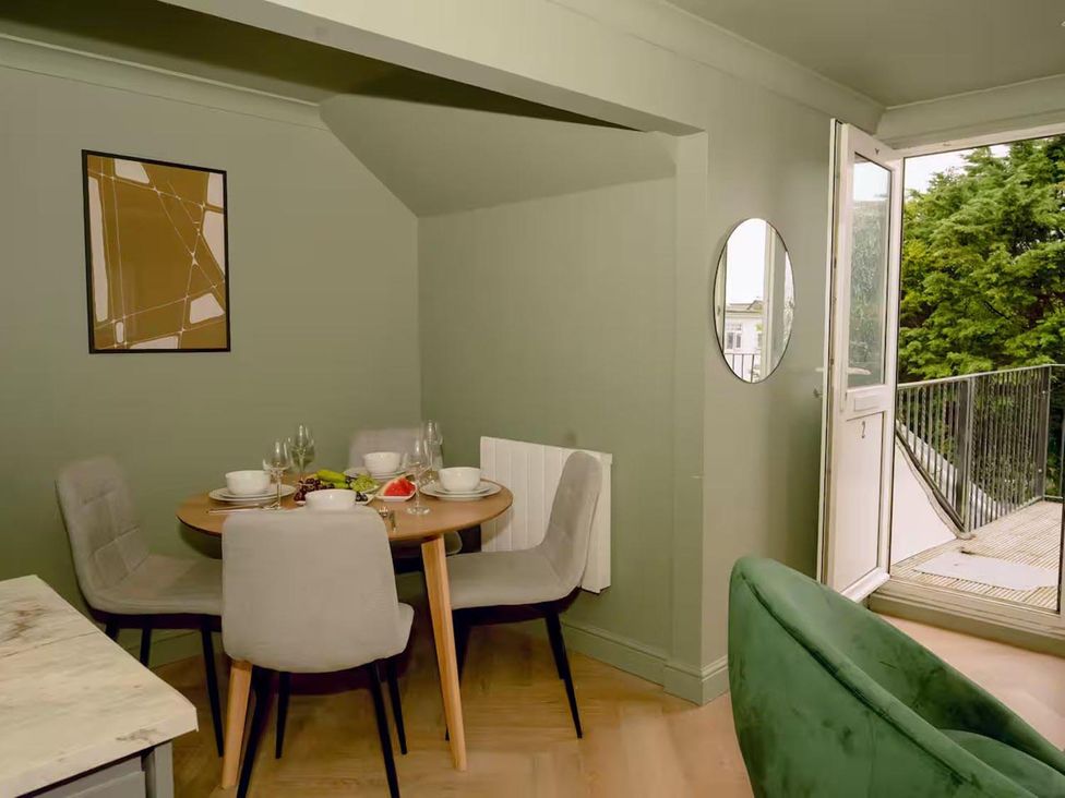 A dining area with a table and chairs at 1 Bedroom Apartment, sleeping 3 with balcony and pet friendly, Carbis Bay