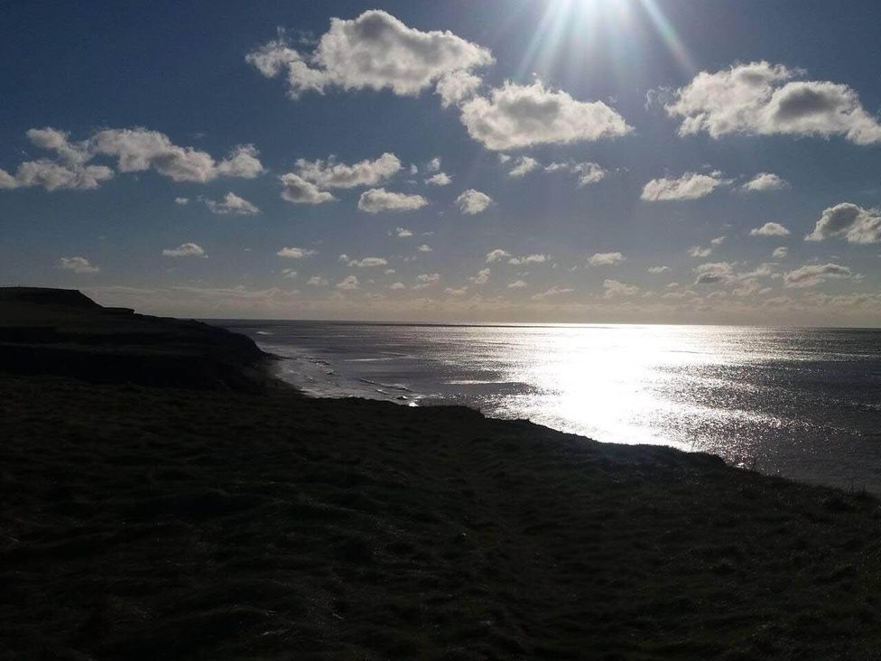 A coastal view with ocean and clouds at Impeccable 3 bed 2 bath Central Cowes Cottage in Cowes