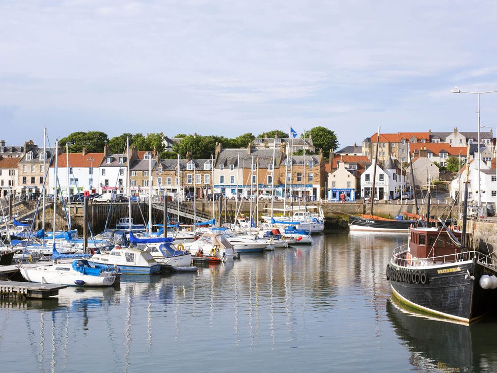 A harbor with boats and buildings at The Old Paint Shop Apartment - Centrally Situated Anstruther