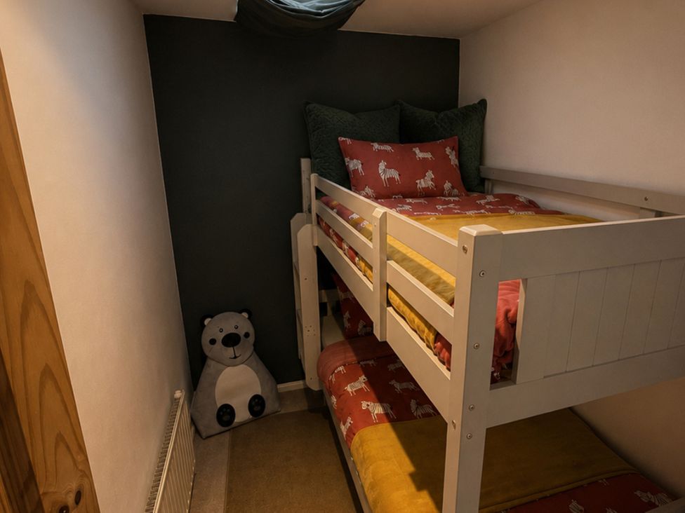 A room with a bunk bed and a stuffed animal at Family Friendly Coach House - Parking - Sleeps 4 Ebdon