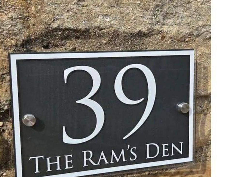 A house number sign displaying 39 The Ram's Den