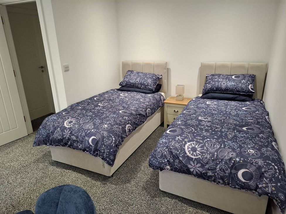 A bedroom with two single beds and a nightstand at Sleeps 2 in a Central Location and is family friendly, Retford