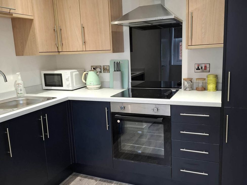 A kitchen with appliances and storage at Sleeps 2 in a Central Location and is family friendly, Retford