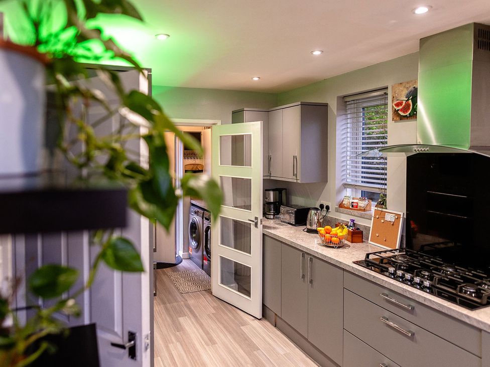 A kitchen with countertop and appliances at 3 Bedroom, sleeping 5 with Wifi in Wythenshawe near Manchester